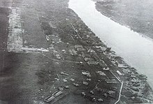 Aerial view of Bintulu town in 1950s. Bintulu airstrip can be seen at the top left corner of the image. Aerial view of Bintulu town in 1950s.jpg