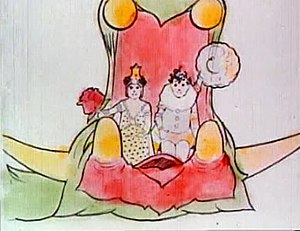 Цветная пленка еще. Зеленый дракон с широко разинутой пастью несет нарядно одетых мальчика и девочку. Девушка слева несет большую розу, а мальчик справа машет шляпой в сторону публики.