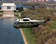 A VH-3D Sea King flying over Washington, D.C. MarineOne flying past the Lincoln memorial.jpg