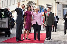 Rathaus in Baden-Baden, Germany, 2009: Barack Obama (the first African American president of the United States), and his wife are welcomed by Angela Merkel (the first woman Chancellor of Germany) and her husband. President and First Lady Obama with Chancellor Merkel.jpg