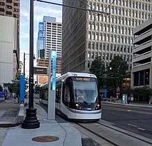 KC Streetcar departing the Library stop, heading north to the River Market Streetcar 10main.jpg