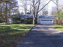 Treys childhood home in Princeton, New Jersey. A ranch style house and driveway.