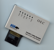A USB Card Reader like this one, will typically implement the USB mass storage device class.