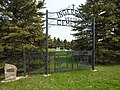 Veeder Cemetery gate behind school building