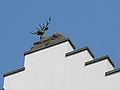 Crow-stepped gables with rooftop deer