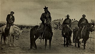 Mongol horsemen on the streets of Urga in 1920.