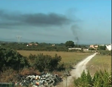 Fire burning near Giugliano, likely due to illegal waste incineration. Fire-TerraDeiFuochi-21-08-2008.png