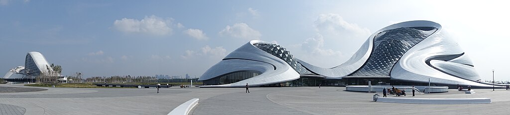 Harbin Grand Theatre, designed by MAD Studio. Located in Harbin's Songbei District, the opera house is surrounded by wetlands and waterways of Songhua River. Harbin Grand Theatre Pano 201609.jpg