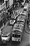 Buses and trams crowd a Buenos Aires street in 1936