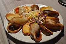 Bulime cooked in garlic butter in Ile des Pins, New Caledonia, species Placostylus fibratus Ile des Pins snails cooked.jpg