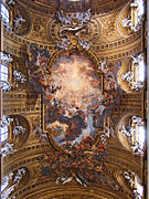 Diadal Jézus nevében. A festmény és az épület összhangját kiteljesítő stukkó reliefek Ercole Antonio Raggi és Leonardo Reti kiegészítései