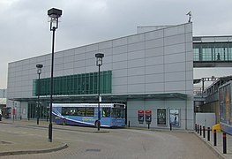 Airport shuttle bus in front of the station