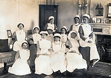 Olive Middleton, far right, seated on arm of couch, in 1915 at Gledhow Hall. Olive's sister-in-law, Gertrude Middleton, is standing beside her Olive Middleton in 1915 (back row, far right) - at Gledhow Hall, the estate of her cousin, Baroness Airedale.jpg