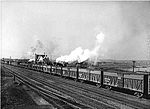 A Santa Fe train with a string of stock cars in 1943