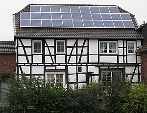 Timber framed house with a photovoltaic array ...