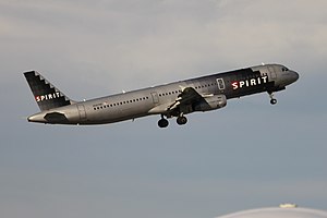 Spirit Airlines N587NK (an A321-231) lifting o...