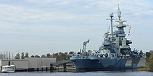 The USS North Carolina Battleship Memorial, seen from downtown Wilmington across the Cape Fear River USS North Carolina-27527.jpg