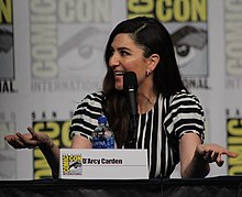 Actress D'Arcy Carden speaking at a panel at San Diego Comic-Con