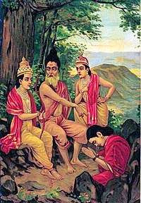 Ahalya (right bottom, seated in a red sari and rising from a stone, bows with folded hands to Rama (left) who is seated with Vishvamitra (centre) on a stone under a tree, in front of her. Lakshamana stands on the right.