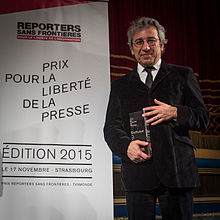 Cumhuriyet's former editor-in-chief Can Dundar receiving the 2015 Reporters Without Borders Prize. Shortly after, he was arrested. Can Dundar prix RSF Strasbourg 17 novembre 2015.jpg