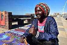 A Rasta street vendor in South Africa's Eastern Cape East London, Eastern Cape, South Africa (20512396425).jpg