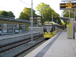 First Metrolink passenger service at West Didsbury, 23 May 2013.jpg