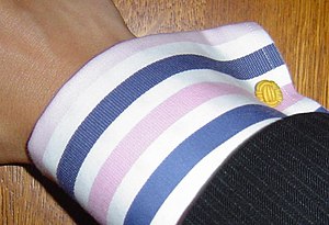 A french cuff tied with a silk knot.