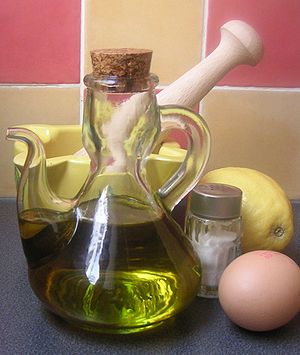 Standard ingredients and tools to make mayonnaise.