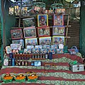 Another non-government vendor outside the temple, selling liquor, flowers and framed photographs