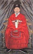 Portrait of Joseon Emperor Gojong wearing hanbok and holding a hol