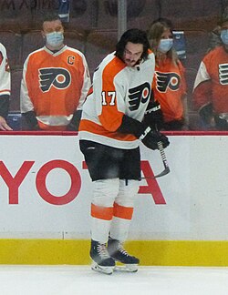 Masked up Flyers fans on the glass and Zack MacEwen (51639982971) (cropped).jpg