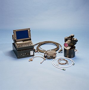 Nikon NASA F4 together with HERCULES measurement and ring laser gyroscope right, its Electronics Box in the center and the laptop mounted atop the HERCULES Playback-Downlink Unit and Attitude Processor left. Nikon F4 ESC NASA.jpg