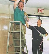 President Bill Clinton installing computer cables with Vice President Al Gore on NetDay at Ygnacio Valley High School in Concord, CA. March 9, 1996 Phoc96v1.jpg
