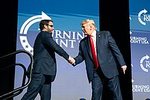Crenshaw with President Donald Trump in December 2019 President Trump Delivers Remarks at TPUSA (49259747427).jpg