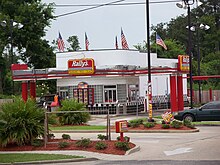 Some fast food chains, such as this Rally's located near New Orleans, Louisiana, have two drive-throughs. Rally's drive-through.jpg