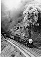 Image 7500 class engine No.502 hauling a freight train in at Eden Hills, August 1953. (from Transport in South Australia)