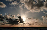 Sunset clouds and crepuscular rays over pacific edit.jpg