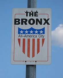 Sign in The Bronx, New York, awarded in 1997 to mark its recovery from the decline of the 1960s-80s. The Bronx - All-America City sign - panoramio.jpg