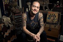 Jesse Tittsworth smiling during a photo shoot