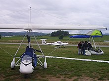 Aerosport airshow 2011 two ultralights and a small airplane.JPG