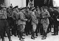 Мучманн (в центрі, між Робертом Леєм і Йозефом Геббельсом) на Імперському з'їзді НСДАП (Нюрнберг, 1937).