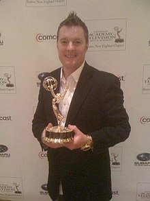 New England sports personality Charlie Moore holding a New England Emmy Award in 2011 Charlie Moore with Emmy Award.JPG