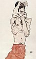 Stojící mužský akt s červenou bederní košilí (1914)