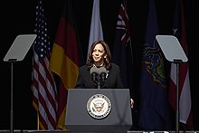 Vice President Kamala Harris in 2021, with the vice presidential seal on the podium Gov. Wolf Honors Flight 93 Passengers and Crew at 20th Annual September 11 Observance (51449810205).jpg