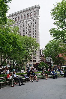 The 1902 Flatiron Building rises above the park Madison Square (7169969917).jpg