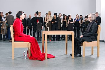 Marina Abramovic's The Artist is Present, 2010, Museum of Modern Art, New York. Abramovic sat silently opposite museum visitors for eight hours a day for three months, a total of 750 hours. Marina Abramovic, The Artist is Present, 2010 (2).jpg
