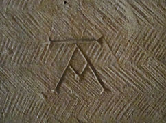 Mason's mark in the Église Saint-Honorat [fr] in Alyscamps, France, early 13th century