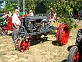 A Farmall tractor with road bands fitted to facilitate driving on paved roads