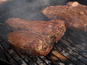 Porterhouse steak on a grill