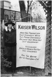 "Kaiser Wilson" banner held by a woman who picketed the White House Suffragette banner. One of the banners, the women who picketed the White House . . . - NARA - 533769.tif